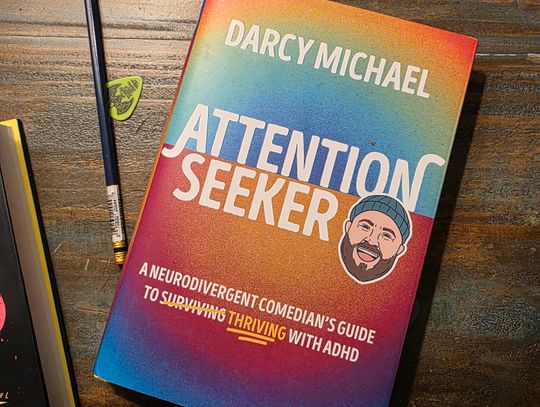 “Attention Seeker: A Neurodivergent Comedian’s Guide to Thriving with ADHD” by Darcy Michael