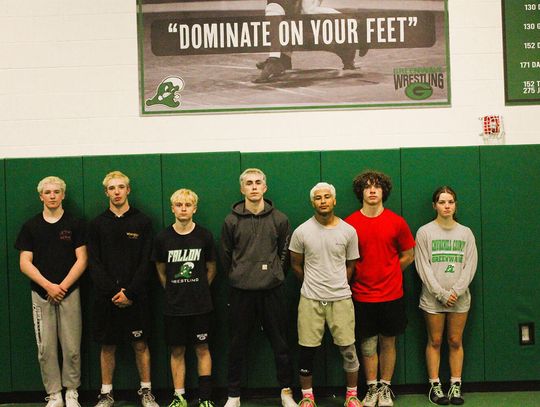 CCHS Wrestling Room Honors State Champions with New Signs