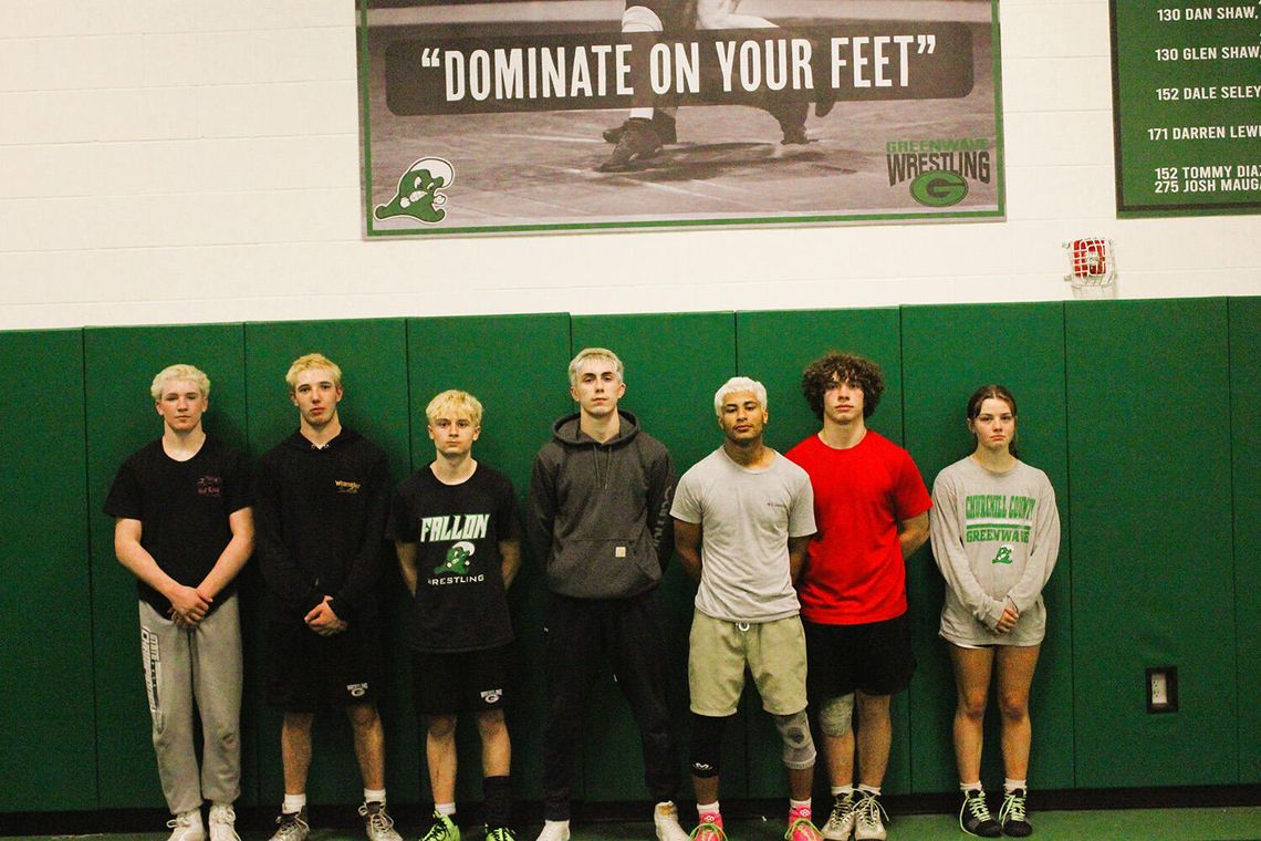 CCHS Wrestling Room Honors State Champions with New Signs