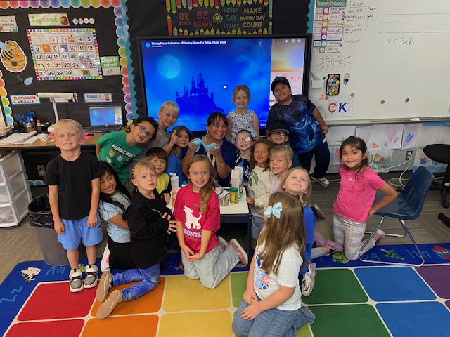 Heather Sorensen and her first-grade students show their slime