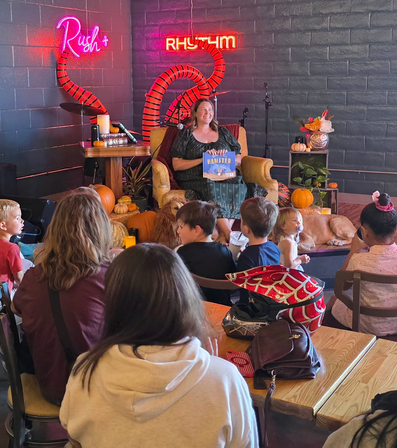 Janet Renfro reads to children at Rush and Rhythm.
